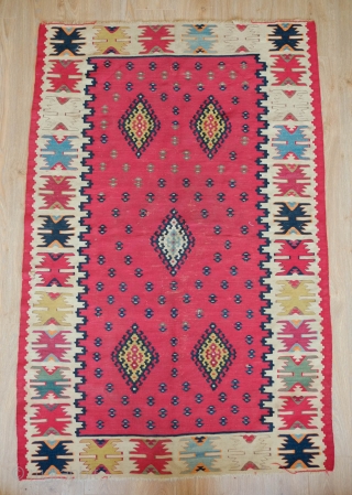 Sarkoy/Pirot Kilim, Late 19th Century to 1900 or so.  Beautiful poised composition like a ripple in a lake from the central medallion.  All good colors.  105 x 156 cm 