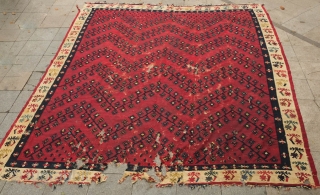 Sarkoy kilim, 19th century.  Beautiful saturated cochineal ground with zigzagging branches.  Playful animalistic floral motifs along the white borders.  A kilim that resonates despite its obvious damage.  334  ...