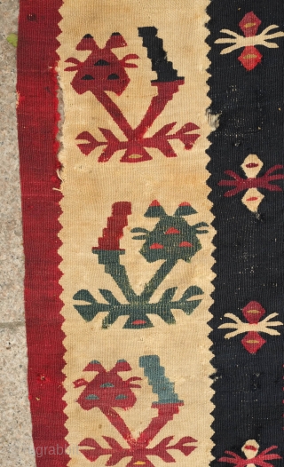 Sarkoy kilim, 19th century.  Beautiful saturated cochineal ground with zigzagging branches.  Playful animalistic floral motifs along the white borders.  A kilim that resonates despite its obvious damage.  334  ...