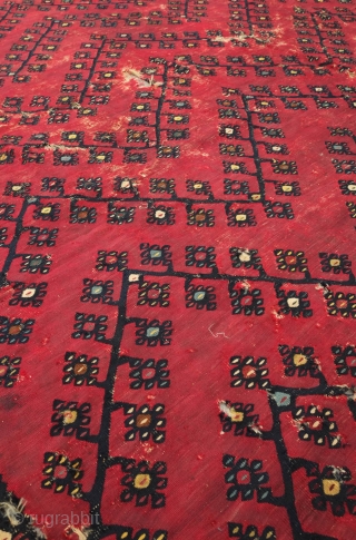 Sarkoy kilim, 19th century.  Beautiful saturated cochineal ground with zigzagging branches.  Playful animalistic floral motifs along the white borders.  A kilim that resonates despite its obvious damage.  334  ...