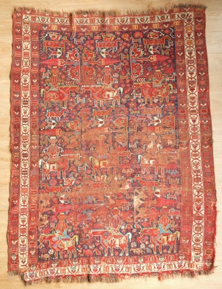 Khamseh rug, 3rd to 4th quarter of the 19th century.  A wonderful array of mounted tribesmen in the field amidst unique half abstract winged medallions.  The field is filled with  ...