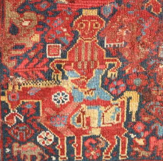 Khamseh rug, 3rd to 4th quarter of the 19th century.  A wonderful array of mounted tribesmen in the field amidst unique half abstract winged medallions.  The field is filled with  ...