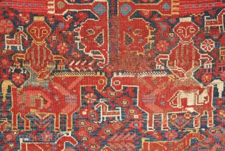 Khamseh rug, 3rd to 4th quarter of the 19th century.  A wonderful array of mounted tribesmen in the field amidst unique half abstract winged medallions.  The field is filled with  ...