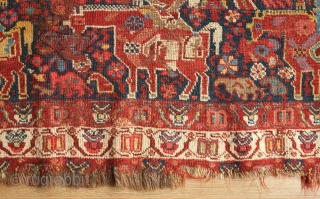 Khamseh rug, 3rd to 4th quarter of the 19th century.  A wonderful array of mounted tribesmen in the field amidst unique half abstract winged medallions.  The field is filled with  ...