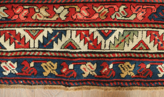 Karabagh rug, 19th century.  The deep black ground acts as a perfect foil for the exquisite geometric floral motifs. Excellent condition.  115 x 253 cm      