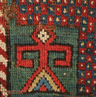 Fachralo green ground rug, 19th century. Wonderful field of green, kochanak border and elibelinde motifs on both ends of the field.  Obvious wear but all there. 142 x 234 cm  