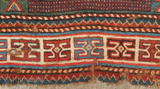 Fachralo green ground rug, 19th century. Wonderful field of green, kochanak border and elibelinde motifs on both ends of the field.  Obvious wear but all there. 142 x 234 cm  