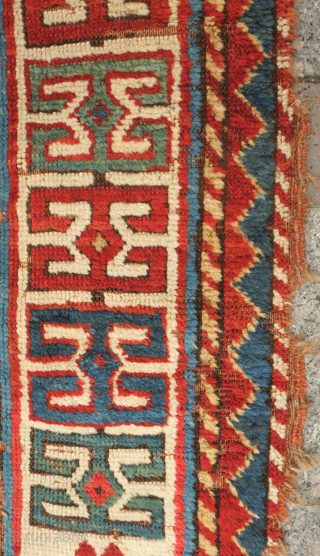 Fachralo green ground rug, 19th century. Wonderful field of green, kochanak border and elibelinde motifs on both ends of the field.  Obvious wear but all there. 142 x 234 cm  