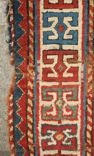 Fachralo green ground rug, 19th century. Wonderful field of green, kochanak border and elibelinde motifs on both ends of the field.  Obvious wear but all there. 142 x 234 cm  