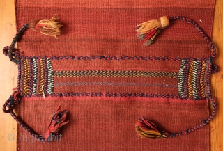 Khamseh Khorjin, late 19th century.  A fantastic bag with almost all tassels in tact.  Colorful and rich extra wrapping along the center.  The wool is lustrous.  In about  ...