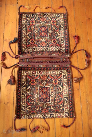 Khamseh Khorjin, late 19th century.  A fantastic bag with almost all tassels in tact.  Colorful and rich extra wrapping along the center.  The wool is lustrous.  In about  ...