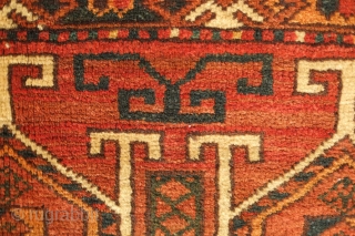 Ersari jollar, late 19th century.  Good colors with an apricot and a deep green.  Motifs resembling portals or grave stones topped with ram's horns for protection.  One small spot  ...