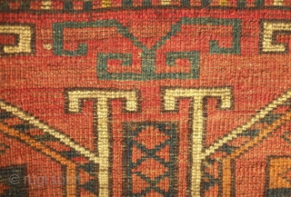 Ersari jollar, late 19th century.  Good colors with an apricot and a deep green.  Motifs resembling portals or grave stones topped with ram's horns for protection.  One small spot  ...