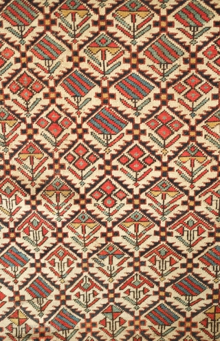 Shirvan prayer rug, 19th century. Good colors and "V" orientation of the floral lattice motifs. Outer-most border is missing. Selvedge is intact. 100 x 137 cm
       