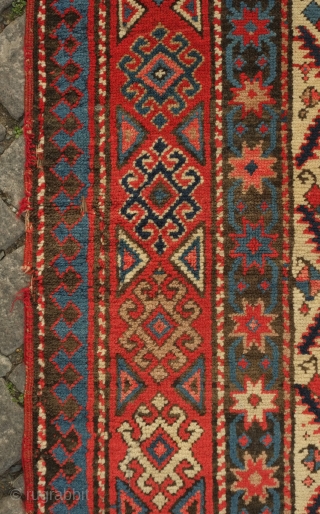 Genje long rug, 19th century. Overall lattice shield palmette field on a white ground.  A small area of repair in the top left-hand corner. Overall good condition.  111 x 248  ...