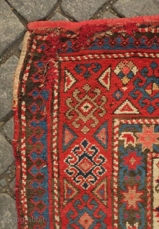 Genje long rug, 19th century. Overall lattice shield palmette field on a white ground.  A small area of repair in the top left-hand corner. Overall good condition.  111 x 248  ...