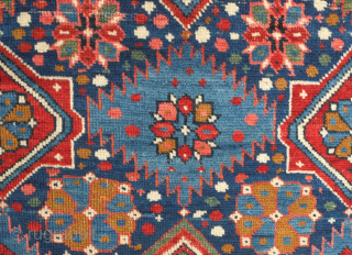 Kuba rug, 19th century. Stunning saturated jewel-like colors. This Kuba rug is brimming with a variety of palmettes and medallions. Striking kufic border. Excellent condition. 128 x 213 cm.    