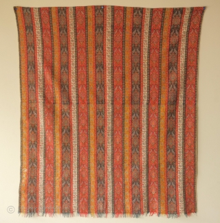 Kerman Shawl, 19th century.  Finely woven cartouche motifs with botehs flanking the top and bottom. Note the inscription in white wool.  The shawl has been expertly rejoined across the middle  ...