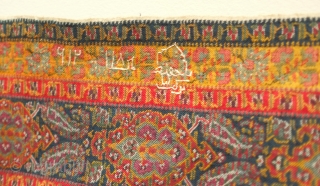 Kerman Shawl, 19th century.  Finely woven cartouche motifs with botehs flanking the top and bottom. Note the inscription in white wool.  The shawl has been expertly rejoined across the middle  ...