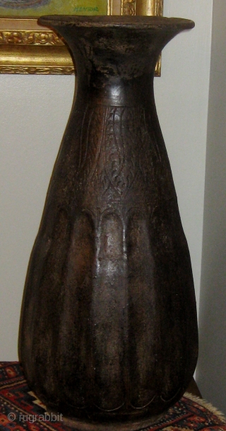 14th-15th Century oversize Khmer temple vase, incised decoration on  the upper half, faceted bottom half, some restorations.  Approximately 24" high, 11" across at its widest.  Please ask for additional  ...