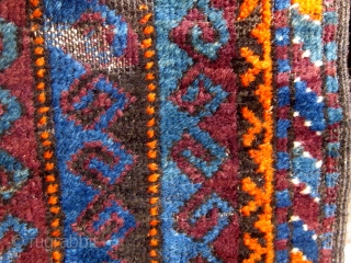 Very unusual antique Baluch bag front, last quarter of the 19th century, with an unusual array of deeply saturated natural colors including various shades of blue, green, aubergine, deep apricot, etc.   ...