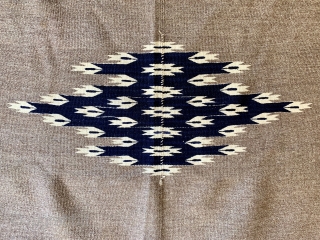 Antique Chimayo Rio Grande child serape, first quarter of the 20th century or earlier, finely hand woven of hand spun natural and indigo dyed wool.  Please ask for additional photos.  