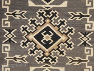 Antique Navajo "Two Grey Hills", circa 1925-1930, 48" by 70", all undyed wool, very fine weave (40 to 50 wefts to the inch), in good condition (one small repair to the edge  ...