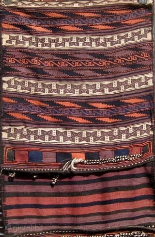 Complete Baluch khorjin in beautiful condition, fine weave, floppy handle, and wonderful design, first quarter of the 20th century, all dyes natural except for the pale rosy orange which faded from a  ...