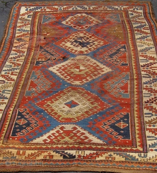 Fresh from a local estate, an antique Caucasian long rug, all natural dyes, 8'9"by 4'5", with some condition issues that will require some restoration as seen in photos.  This rug is  ...