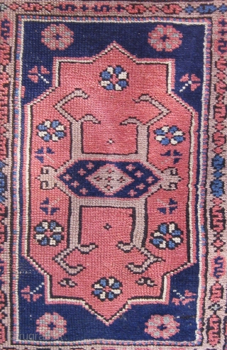 Antique Bergama area Canakkale carpet, circa 1900.  Very unusual format with four large cartouches in the field.  Edges original.  Muted palette with a lovely blue-green not obvious in photos.  ...