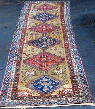 Very folksy Kurdish runner from Western Persia, mid-20th century, in excellent condition.  Beautiful wool, full pile, signed and/or dated (see the last two photos, with human and animal figures.  42"  ...