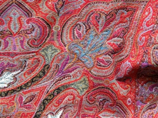 Antique Kashmiri paisley shawl, 19th Century, approximately 76" square--fairly large for its type--in good condition with complete embroidered borders, the usual bites in the black center.       