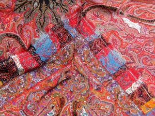 Antique Kashmiri paisley shawl, 19th Century, approximately 76" square--fairly large for its type--in good condition with complete embroidered borders, the usual bites in the black center.       