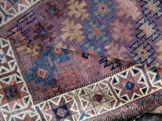 Antique small Baluch rug, symmetrically knotted, with a lovely array of light shades including aubergine, various hues of blue, rose, violet, etc.  Complete with kilim ends, all dyes appear natural with  ...