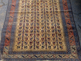 Small antique Baluch camel ground rug with a tree of life variant design, last quarter of the nineteenth century, some wear mainly around the perimeter, edges redone, flat weave ends missing.   ...