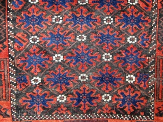 Antique Baluch, circa 1900.  Complete, with unusual extra pile banding on both ends.  Good overall condition with oxidized brown.  Edges and sides original.  33" by 59".   