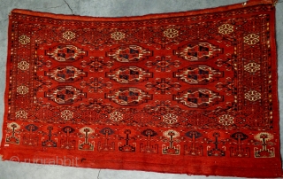 Antique Kizil Ayak chuval, Ersari sub-group, Middle Amu Darya area, with characteristic saturated brick red ground, chemcheh minor guls, in lovely condition, complete skirt and sides. All dyes appear natural, which makes  ...