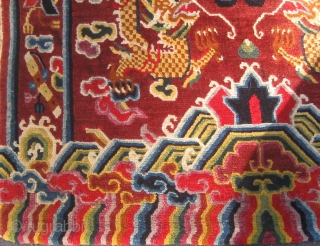 Rare antique Tibetan throne back cover, early 20th century, in pristine condition with original brocade back.  Approximately 15 colors.  Definitely Tibetan made, cut Senneh loop on wool foundation.  For  ...