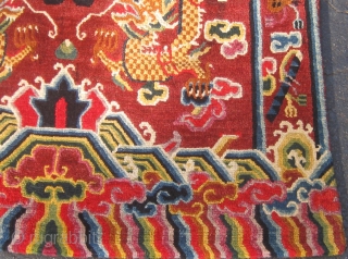 Rare antique Tibetan throne back cover, early 20th century, in pristine condition with original brocade back.  Approximately 15 colors.  Definitely Tibetan made, cut Senneh loop on wool foundation.  For  ...