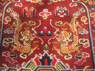 Rare antique Tibetan throne back cover, early 20th century, in pristine condition with original brocade back.  Approximately 15 colors.  Definitely Tibetan made, cut Senneh loop on wool foundation.  For  ...