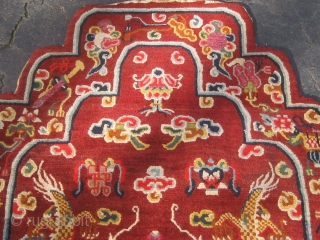 Rare antique Tibetan throne back cover, early 20th century, in pristine condition with original brocade back.  Approximately 15 colors.  Definitely Tibetan made, cut Senneh loop on wool foundation.  For  ...