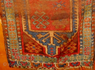 Antique central Anatolian yastik, 19th Century,  distressed but still noble, all natural dyes, 22" by 39".  Please ask for additional photos.          