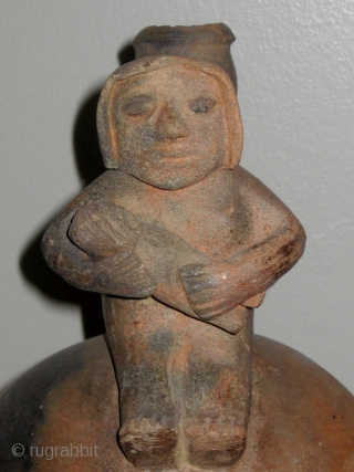 Chavin (Pre-Columbian, 1200 to 400BC) stirrup-spout jar with human figures in the form of a mother holding her swaddled child.  Approximately 10" high.   From a private collection in Charlotte  ...