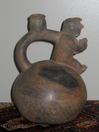 Chavin (Pre-Columbian, 1200 to 400BC) stirrup-spout jar with human figures in the form of a mother holding her swaddled child.  Approximately 10" high.   From a private collection in Charlotte  ...