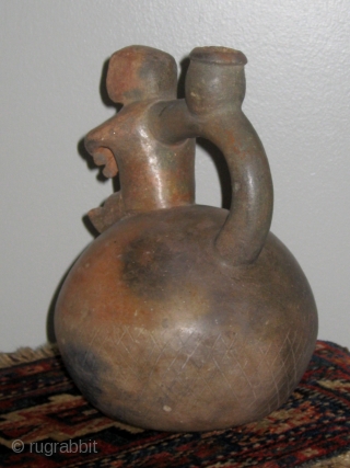 Chavin (Pre-Columbian, 1200 to 400BC) stirrup-spout jar with human figures in the form of a mother holding her swaddled child.  Approximately 10" high.   From a private collection in Charlotte  ...