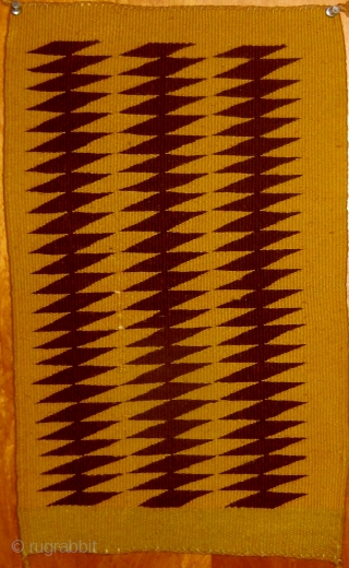 Early 20th Century unusual small Navajo weaving, extremely graphic, with only two colors used.  In pristine condition.  11" by 19".  Please ask for additional photos.     