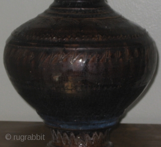 Angkor period (12th Century) Khmer glazed baluster jar, with incised scalloped decoration on shoulder and foot, and carved rings on the mouth, shoulder, and foot.  Please ask for additional photos.  