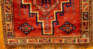 From a Baluch collection a very unusual bagface, 19th century, 20" by 25", original selvages, beautiful yellow border, silky wool, floppy handle, all natural dyes.  Please ask for additional photos.  