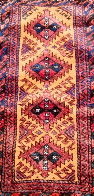 Antique Baluch balisht complete with original flat-woven back, full pile, all dyes appear natural, beautiful condition except for a side bite, original edge work, 19" by 31". Please ask for additional photos. 