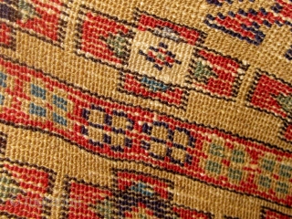 Antique Western Anatolian Kurdish yastik, golden ground, with three  shades of blue, highly saturated red, etc.  All dyes appear natural.  Circa 1890-1910.  Original sides.  All wool construction.  ...